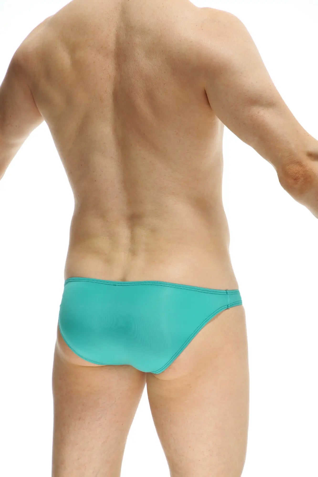 Turquoise swim trunks with smooth form fitting design from petitq bikini dome plum green collection