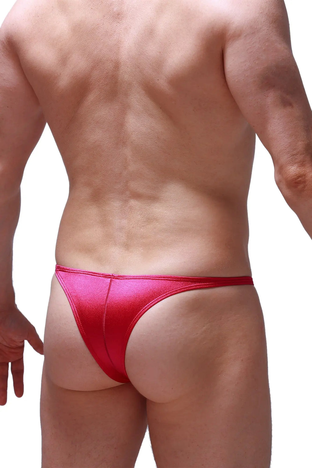 A vibrant red shiny fabric thong from petitq bikini plellis joe framboise with a sleek form-fitting design