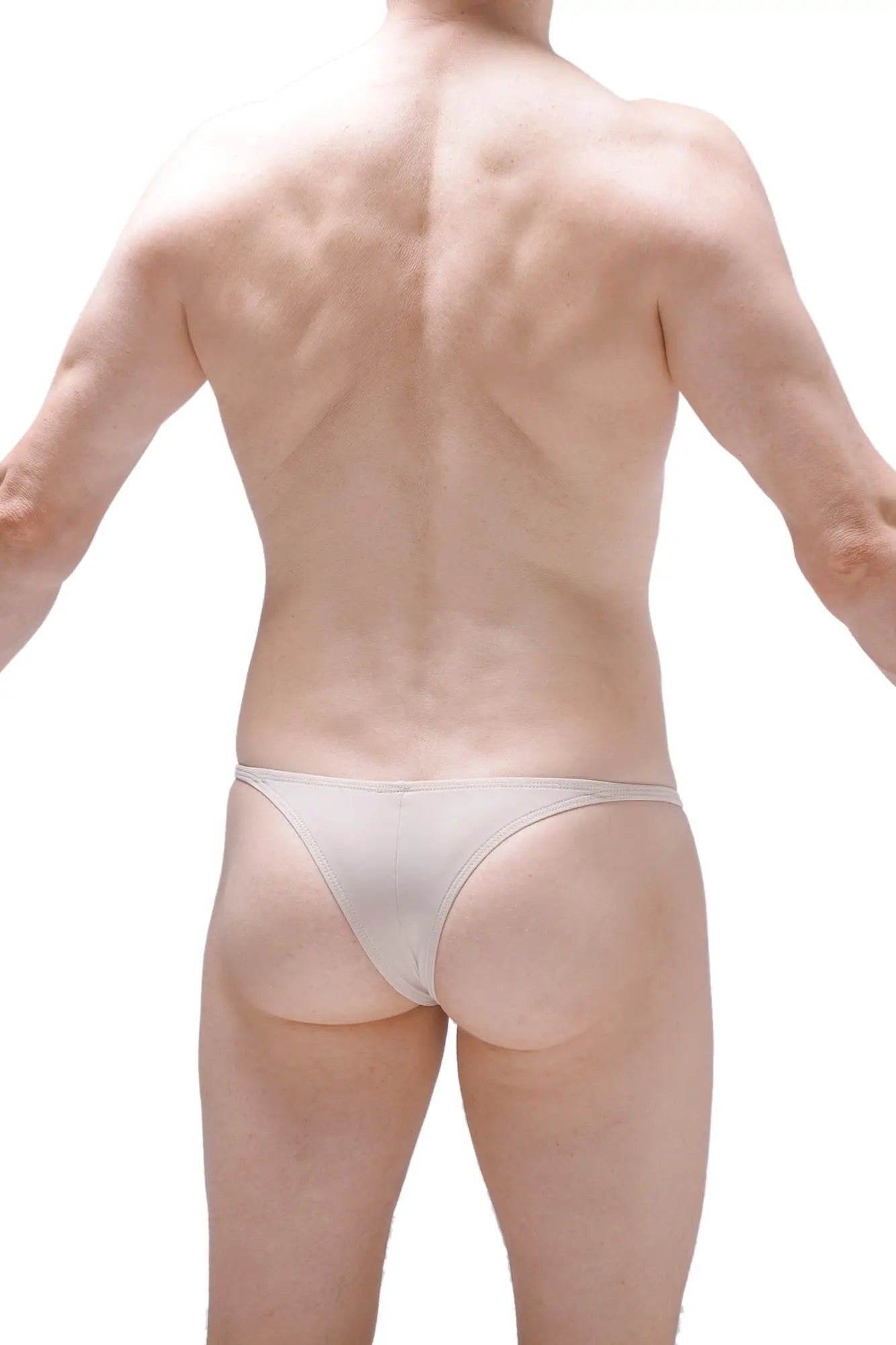A sleek minimalist white PetitQ Bikini Plellis Sand thong made of smooth stretchy fabric shown from the back side