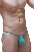 Teal-colored form-fitting PetitQ bikini plellis thong with a small red logo on the side showing the back side