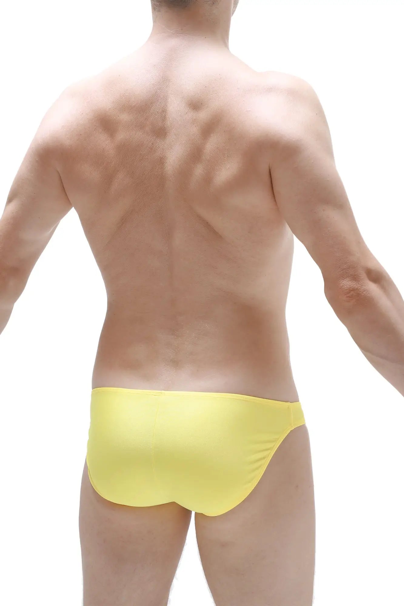 Bright yellow petitq bikini taik joe swim trunks with smooth form-fitting fabric for comfortable beachwear