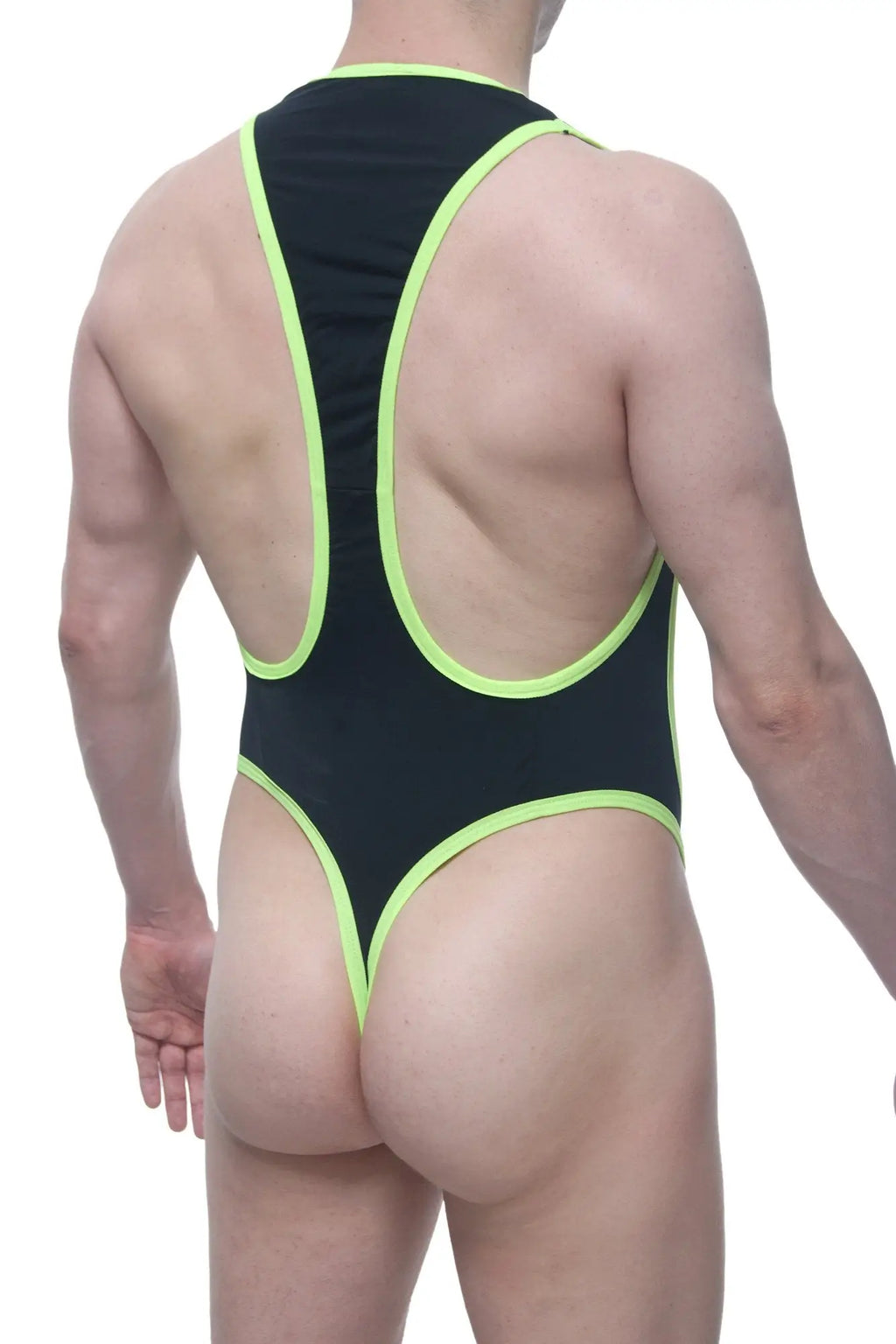 Back view of petitq bodythong deluz black wrestling singlet in black and neon green with cutout back design