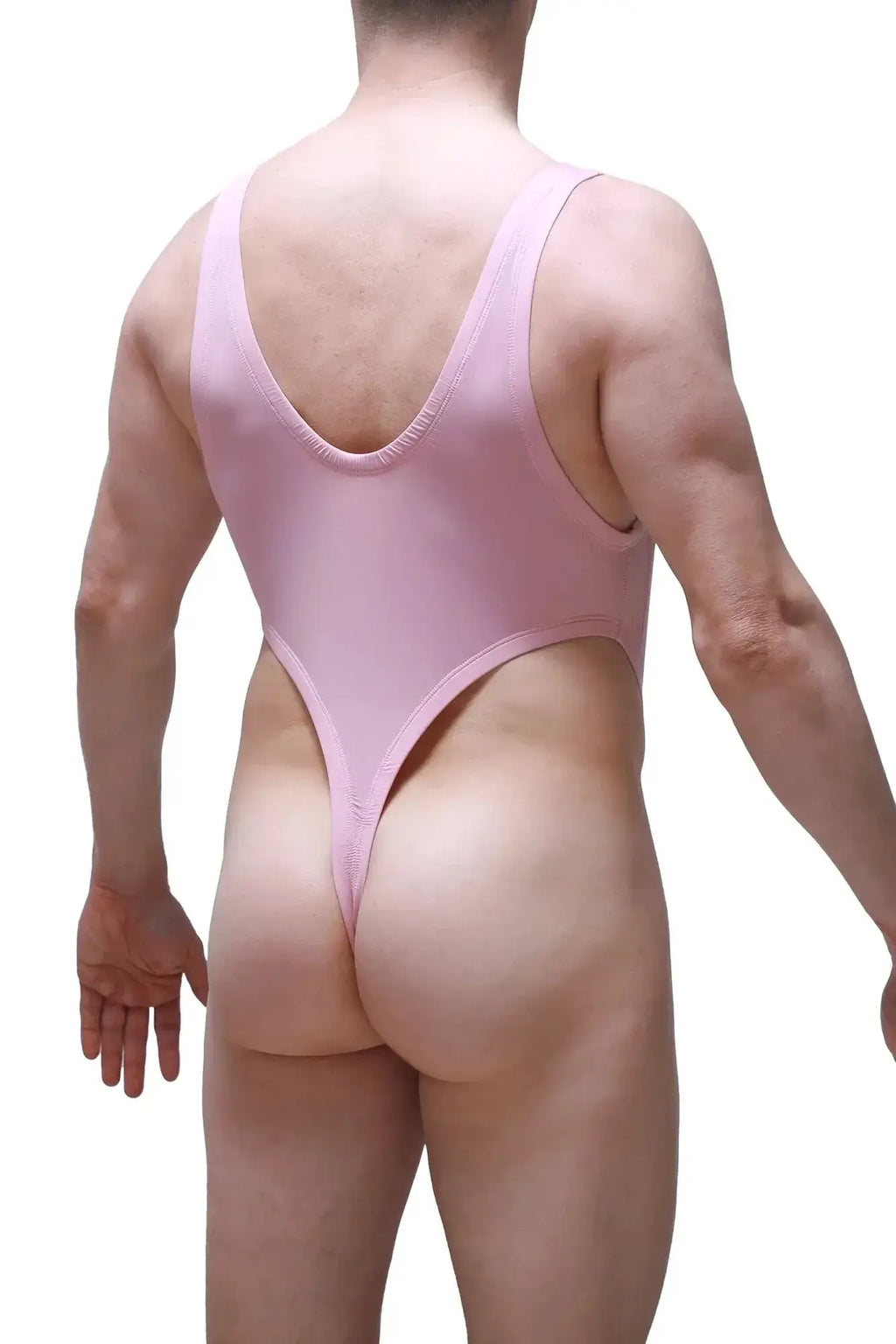 A sleek pink petitq bodythong gonzac skine tea rose one-piece swimsuit shown from the back with a deep v-back.