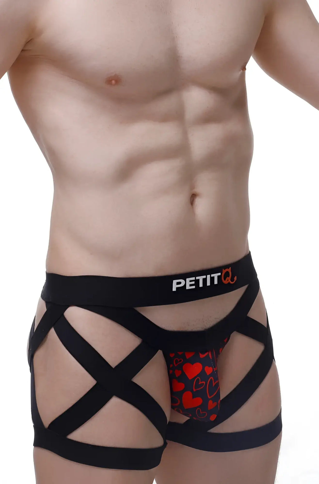 Black strappy men’s PetitQ boxer with red heart pattern and petit branding called King of Hearts