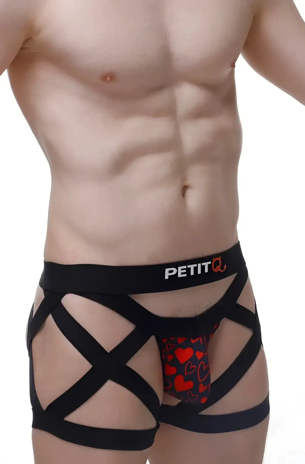 Black strappy men’s PetitQ boxer with red heart pattern and petit branding called King of Hearts