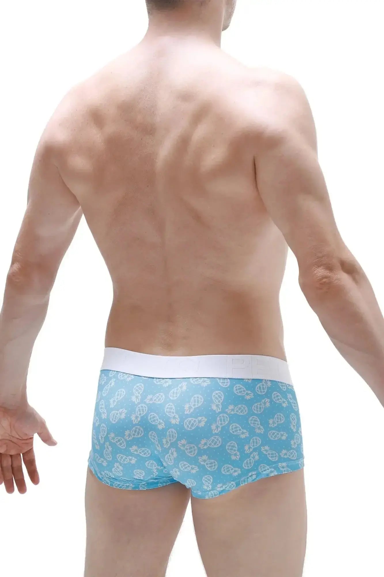 Light blue PetitQ boxer briefs with white waistband and small stylized cartoon characters pattern