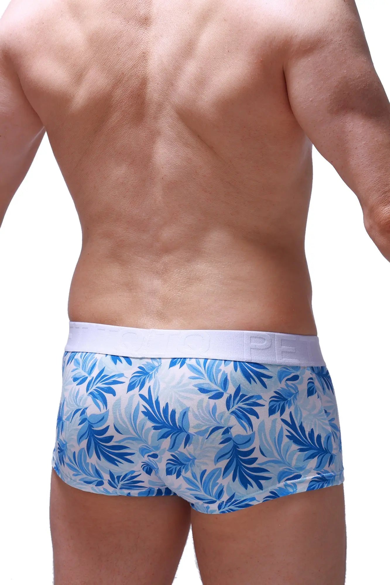 PetitQ boxer brief Maeha in blue and white tropical leaf pattern with solid white elastic waistband for men