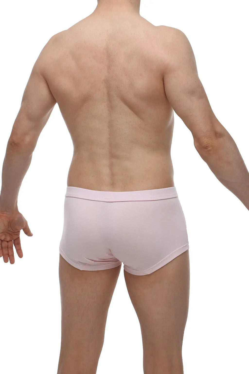A pair of light pink petitq boxer colline bamboo men’s briefs with smooth fabric and elastic waistband
