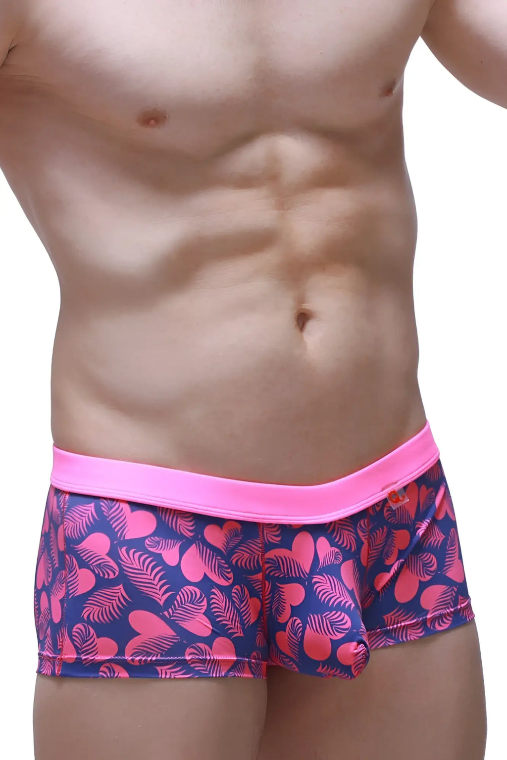 PetitQ boxer Meljac tropical hearts pink and navy blue patterned swim trunks with bright pink elastic waistband