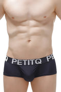 Black petitq men’s briefs with a white logo band made from soft fabric for comfortable everyday wear