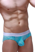 Turquoise mesh briefs with white elastic waistband featuring embossed lettering from petitq brief dome marbre green collection