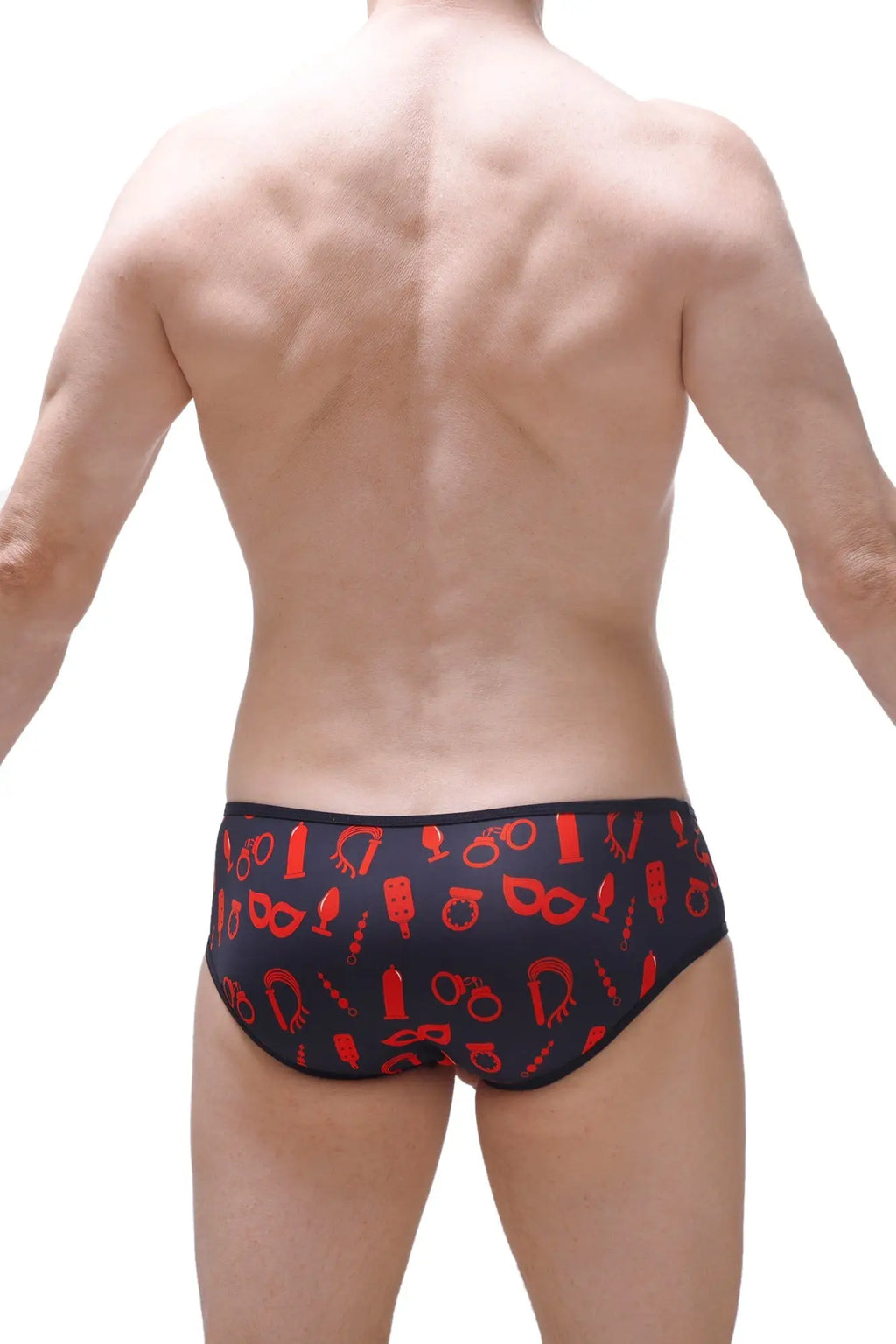 Black swim trunks with bold red graphic pattern featuring various symbols for PetitQ Brief Hole Cockring Boudoir