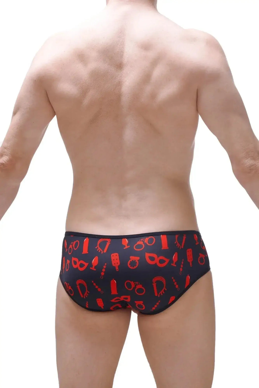 Black swim trunks with bold red graphic pattern featuring various symbols for PetitQ Brief Hole Cockring Boudoir