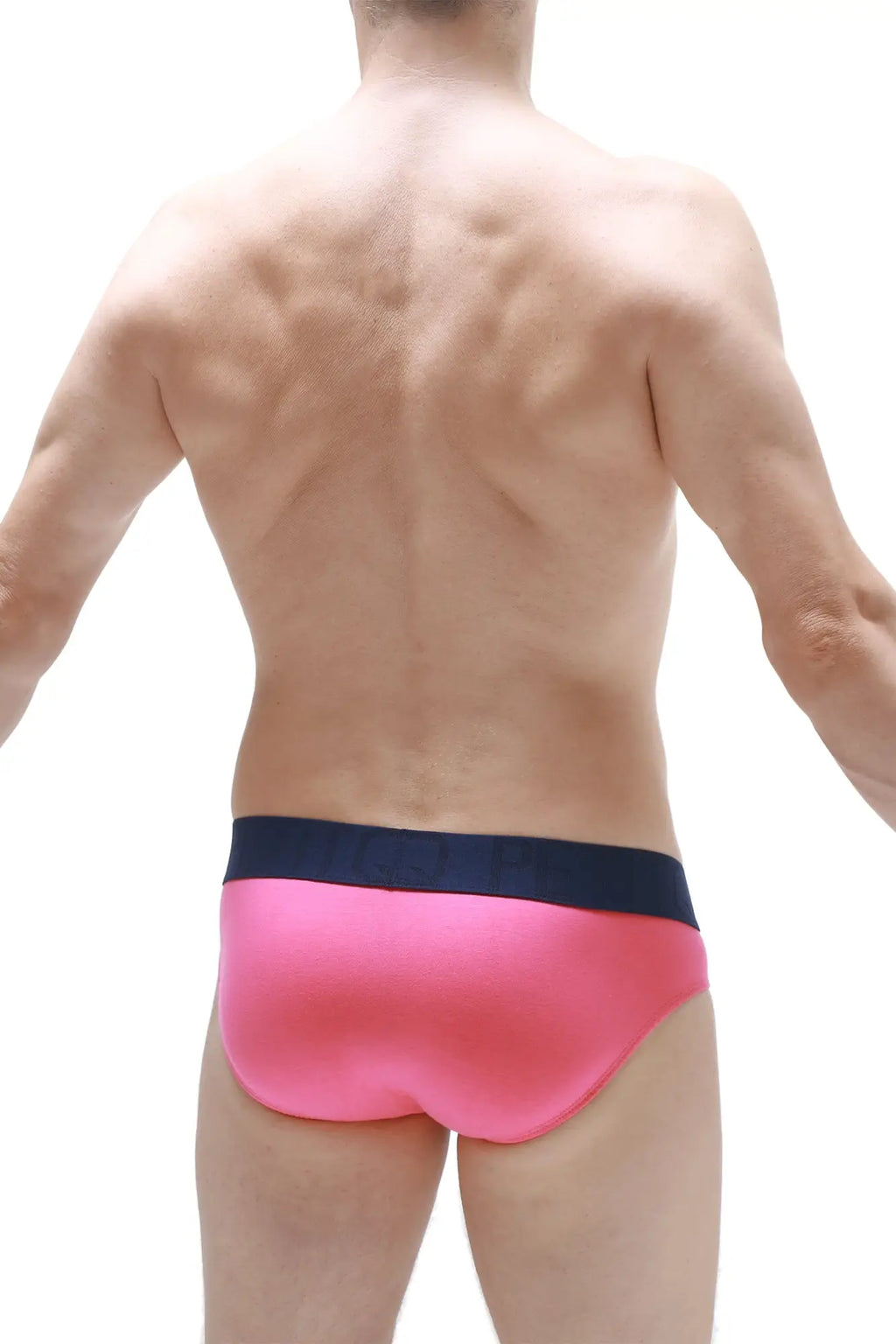 Bright pink petitq brief swim trunks with contrasting navy blue waistband designed for comfortable wear