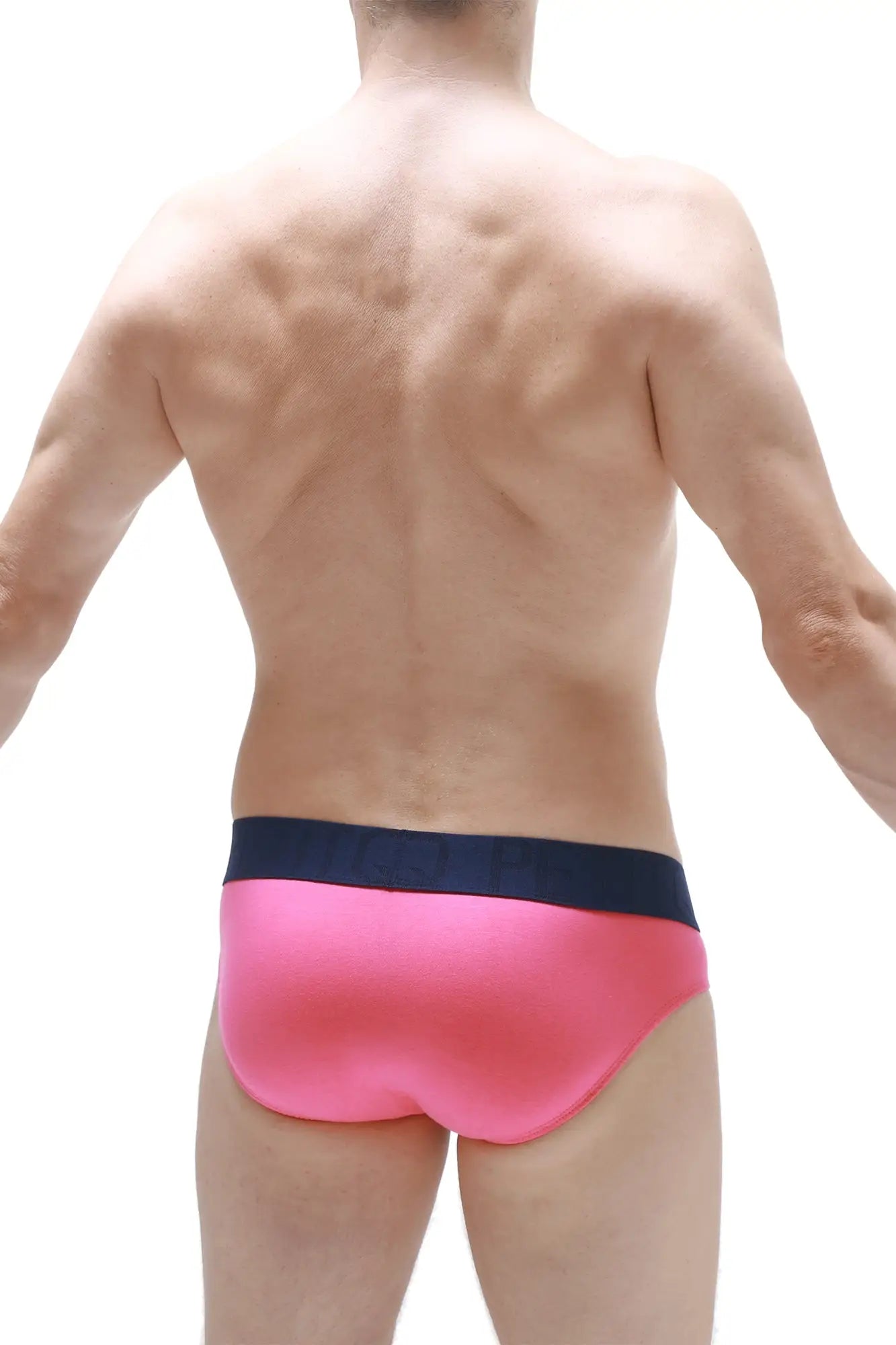 Bright pink petitq brief swim trunks with contrasting navy blue waistband designed for comfortable wear