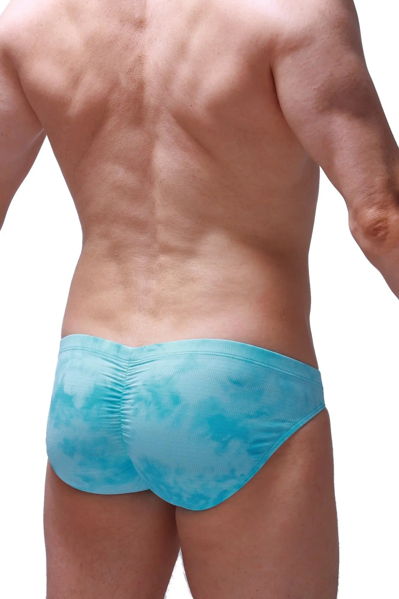 Light blue tie-dye swim trunks with ruched back design from petitq brief peraut marbre green collection