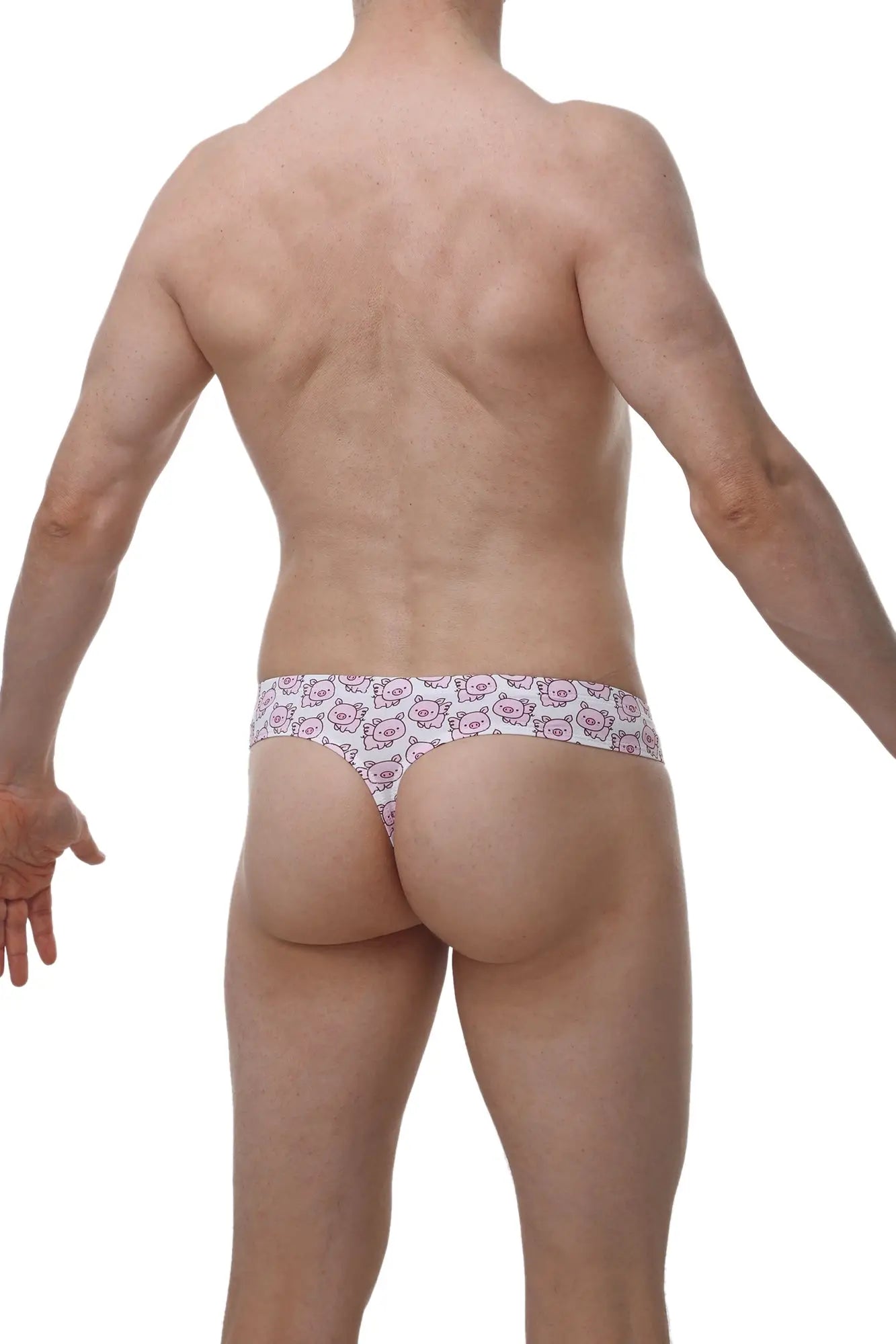 White petitq cheeky thong with repeating pink cartoon cat faces pattern on soft fabric front view