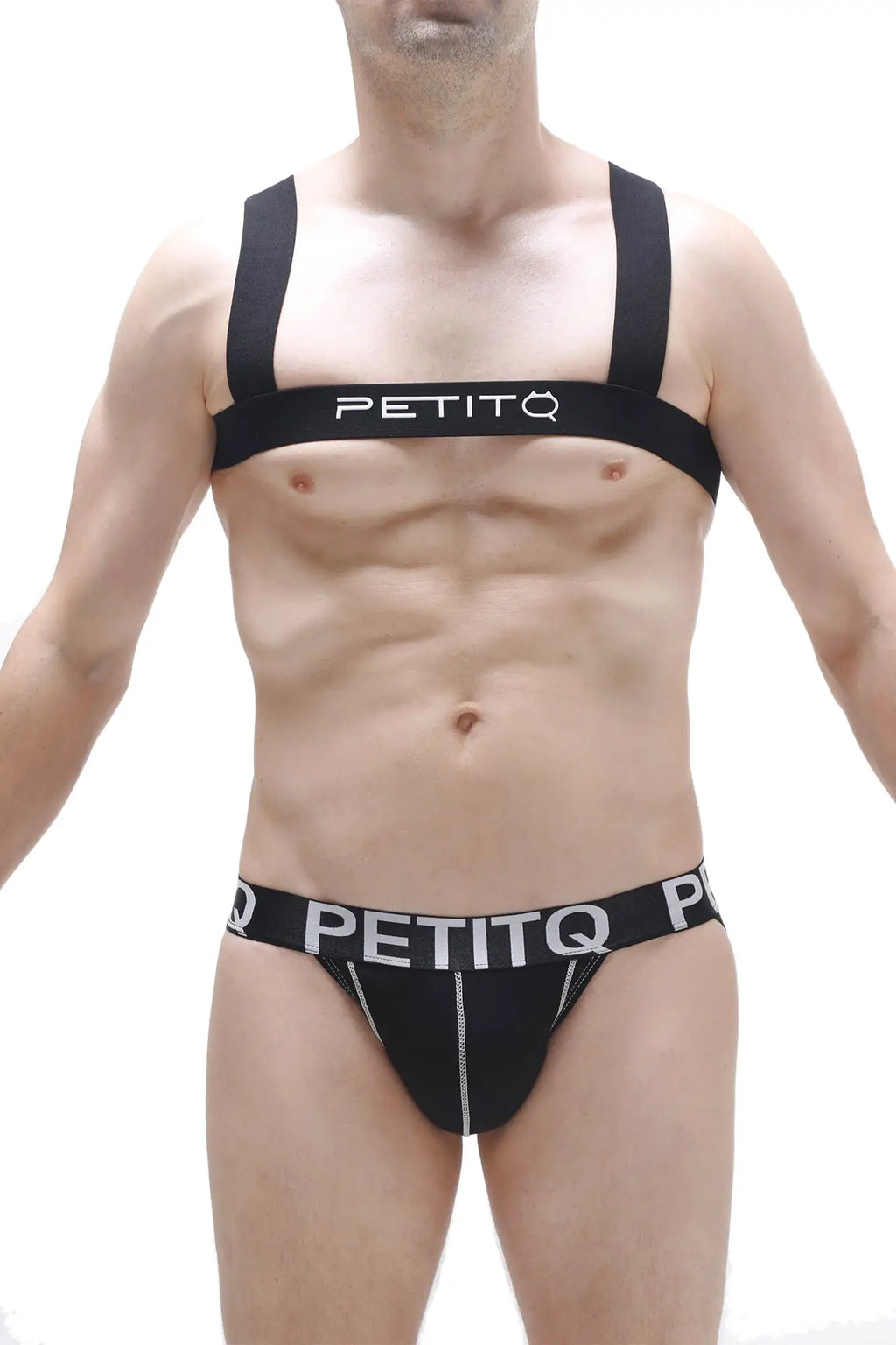 Black petitq harness ancille athletic supporter with white lettering and zipper detailing