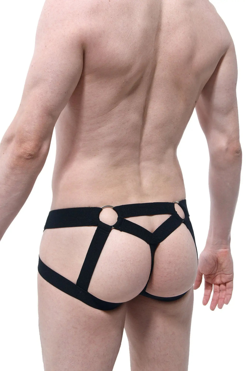 Black harness-style briefs with bold straps and circular metal rings at the waistband from PetitQ Jockstring Beast Black