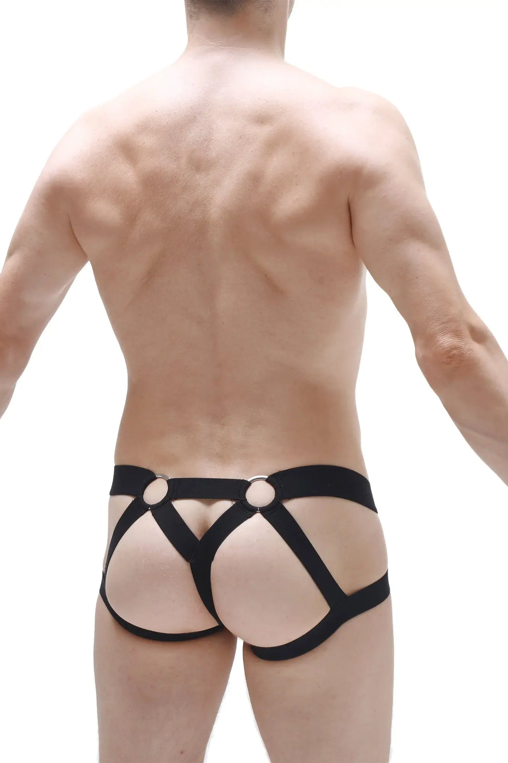 Back view of petitq jockstring brest red black leather-like harness-style briefs with circular metal rings