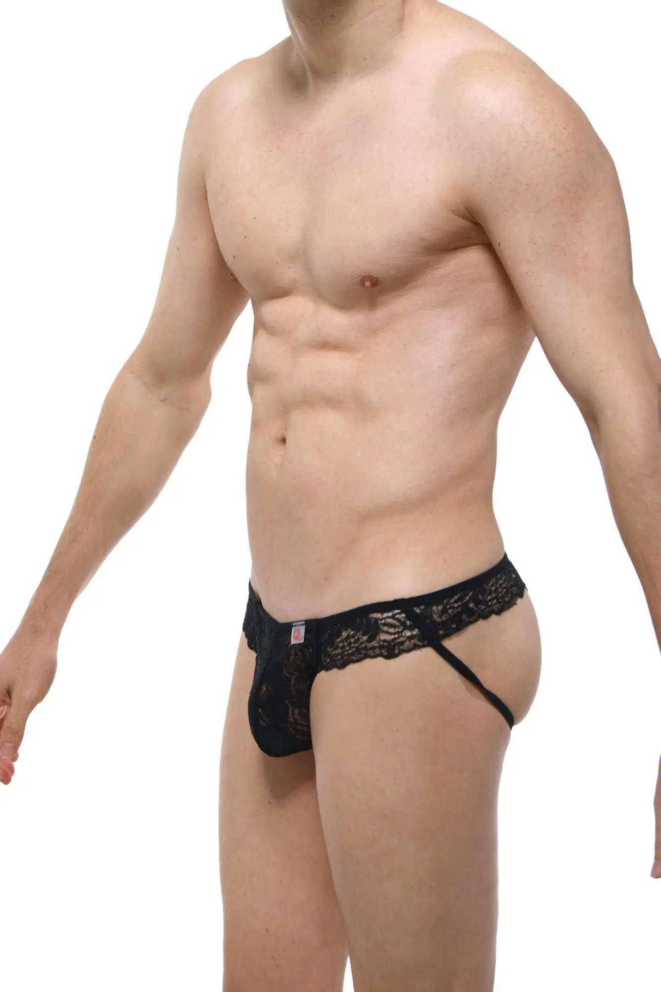 Black lace thong petitQ jockstring lace featuring intricate floral patterns and a small red tag on the waistband