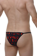 Black thong with red graphic design featuring various symbols from petitq kini boudoir shown from the back side