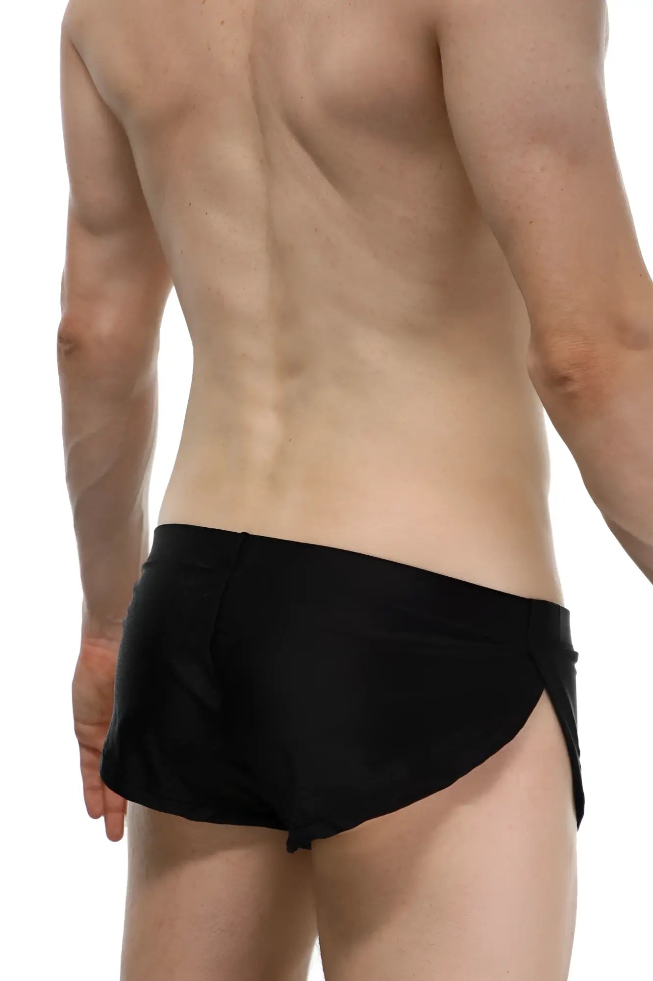 Black petitq running shorts with a sleek form-fitting design and side slits ideal for athletic use