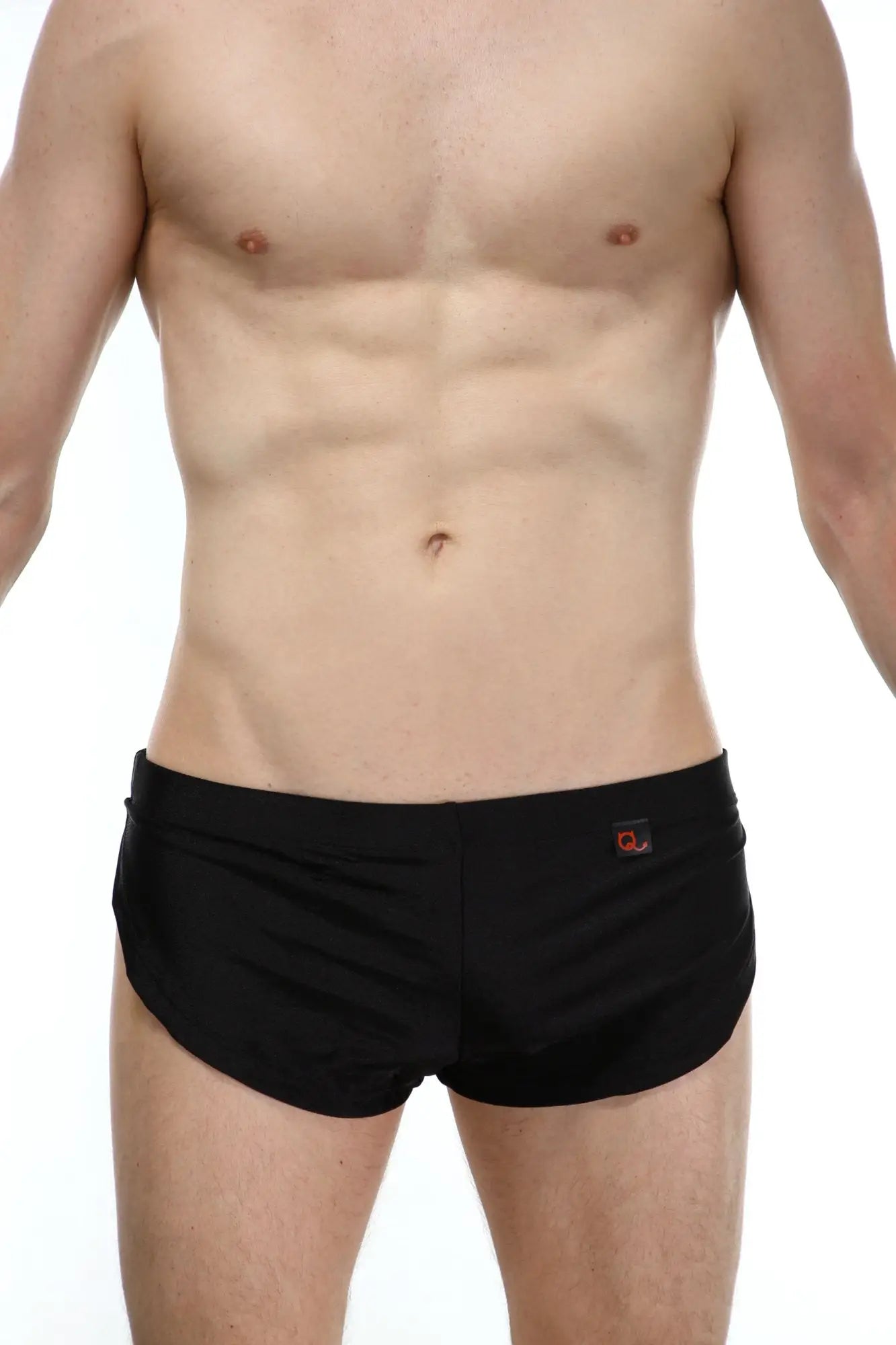 PetitQ running shorts black made of lightweight fabric with black swim trunks featuring a small orange logo on waistband