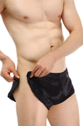 Black satin briefs petitq shorts snap with subtle sheen and small red logo on waistband
