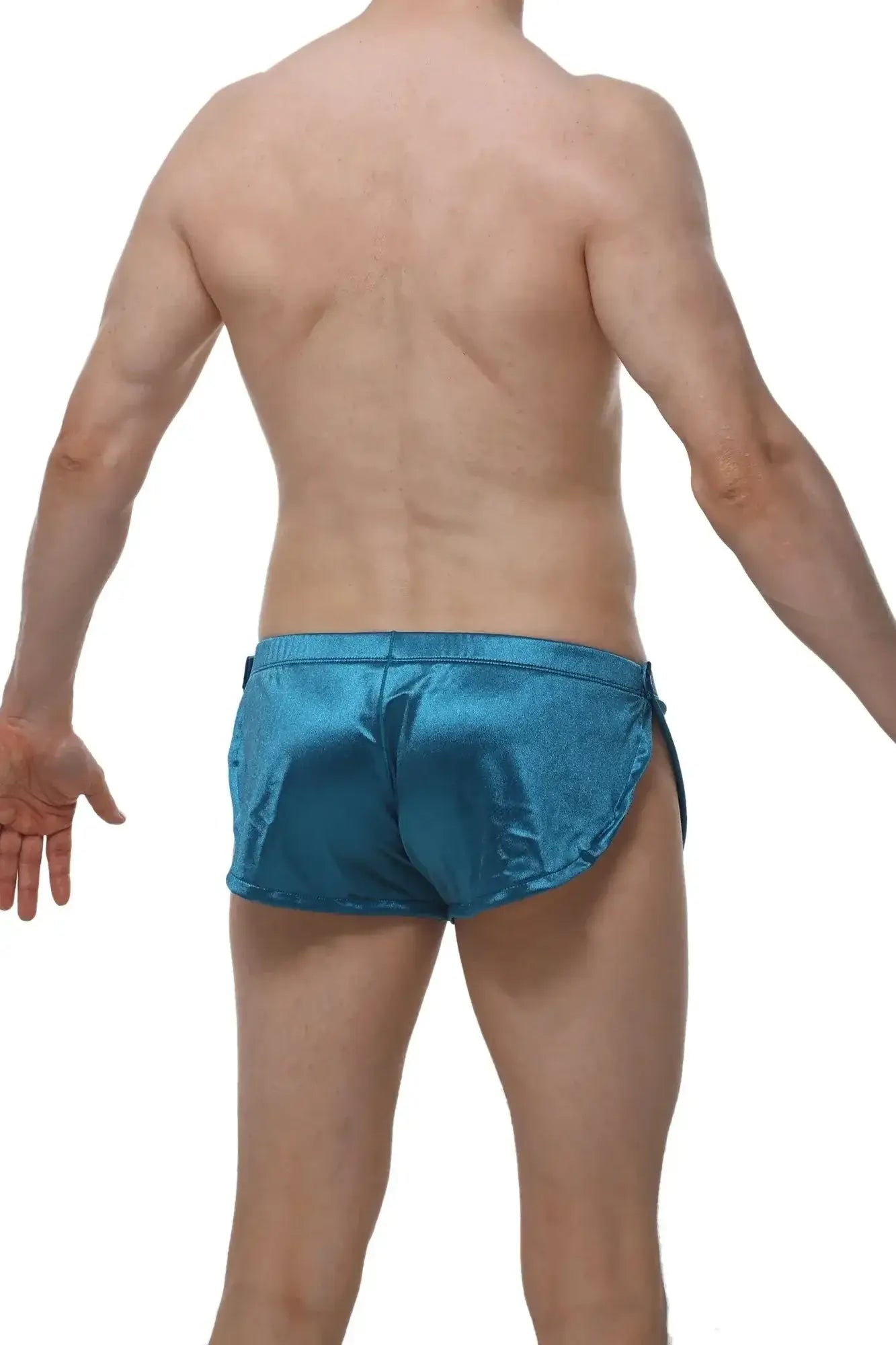 Shiny teal satin swim trunks petitq shorts snap satin with sleek form-fitting design for stylish swimwear use
