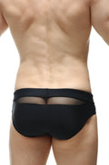 Back view of petitq swim bikini ajoupa black swim trunks with sheer mesh panel in black for stylish swimwear