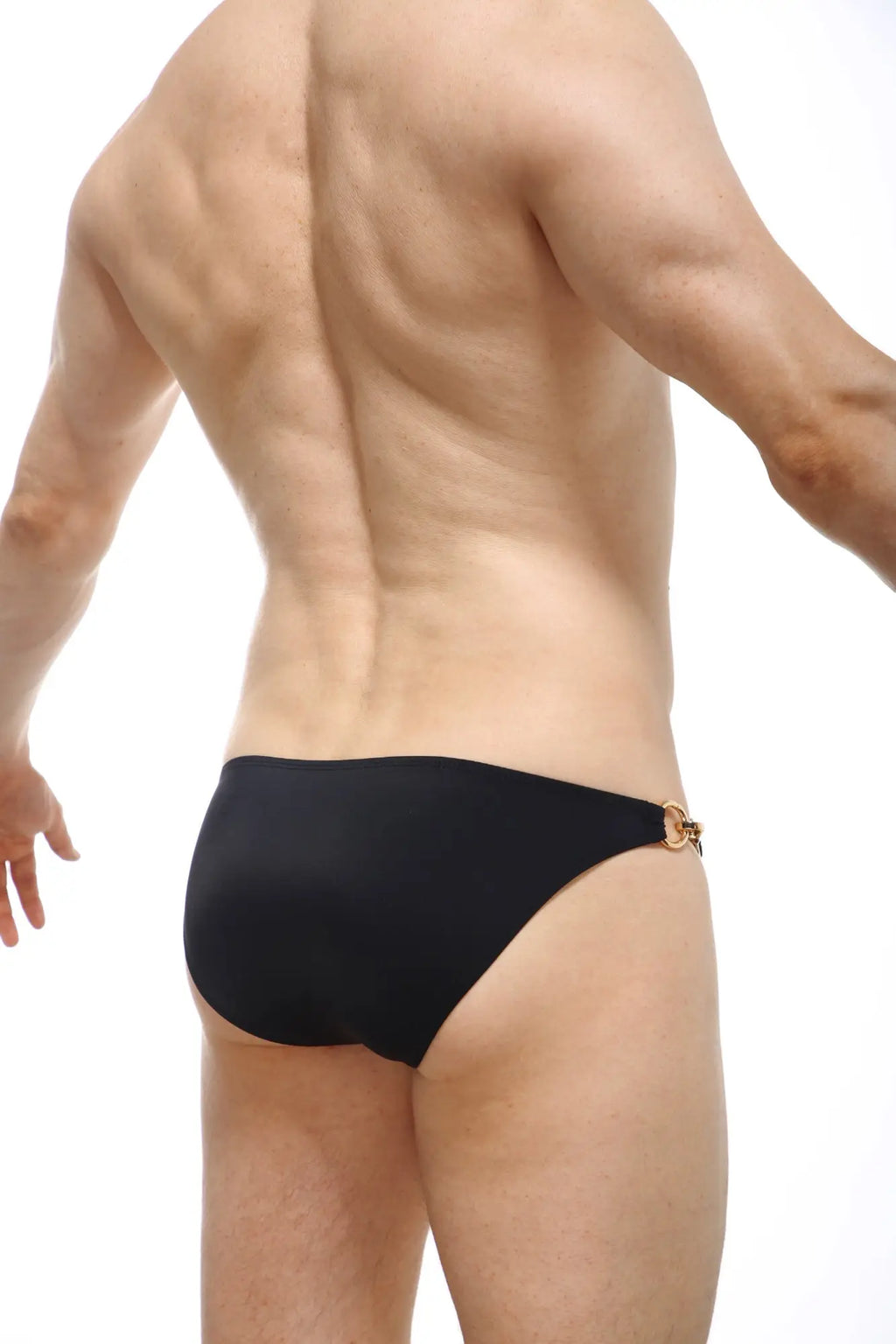 Black swim trunks from PetitQ swim bikini Conguel with gold-toned metal clasp at the waistband back view
