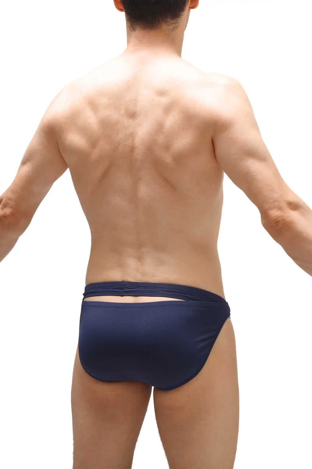 Back view of petitq swim bikini griede recycled navy navy blue swim trunks with cutout detail made from recycled fabric