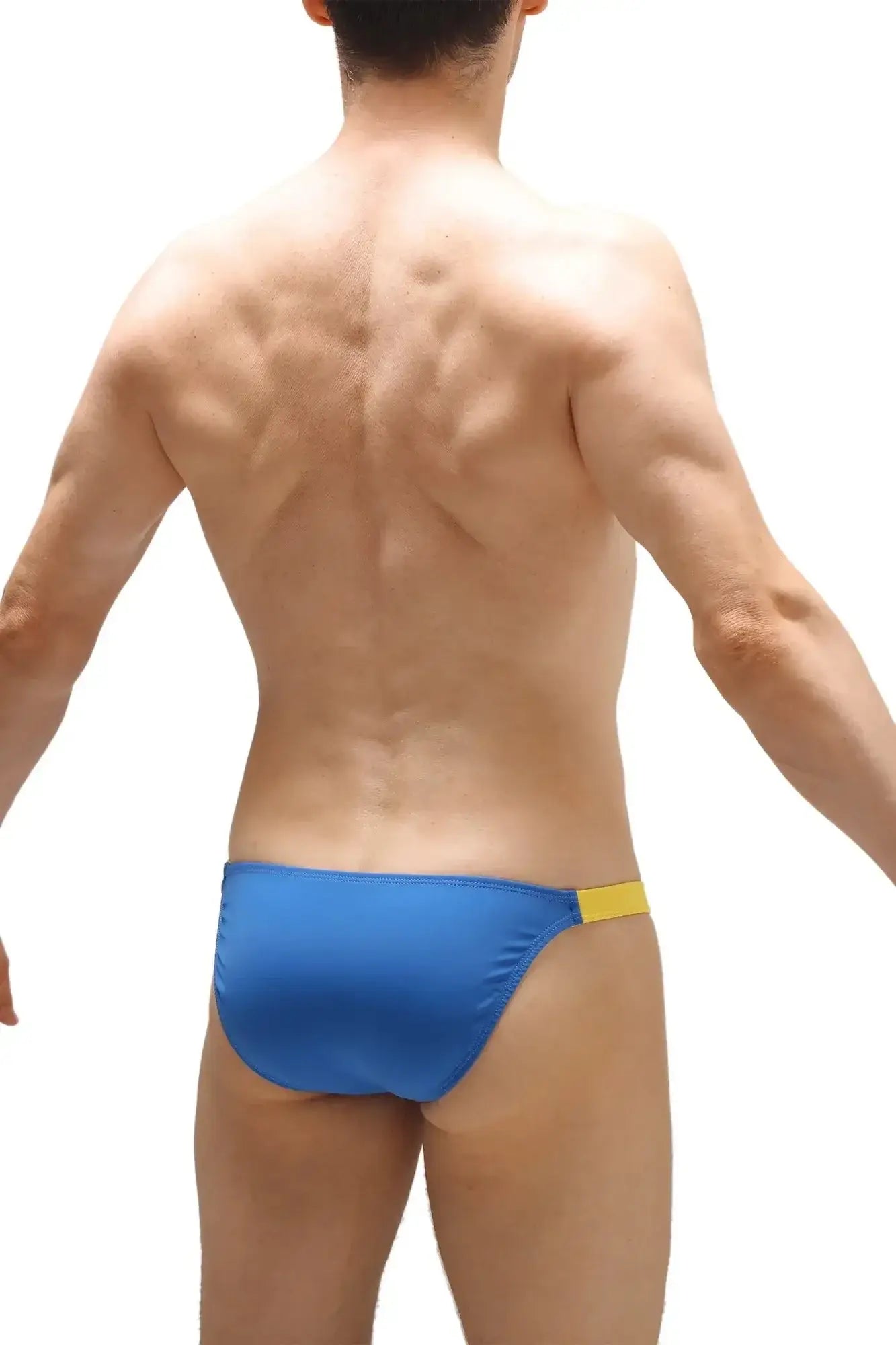 Blue swim trunks with yellow waistband made from econyl by petitq for sustainable swimwear use