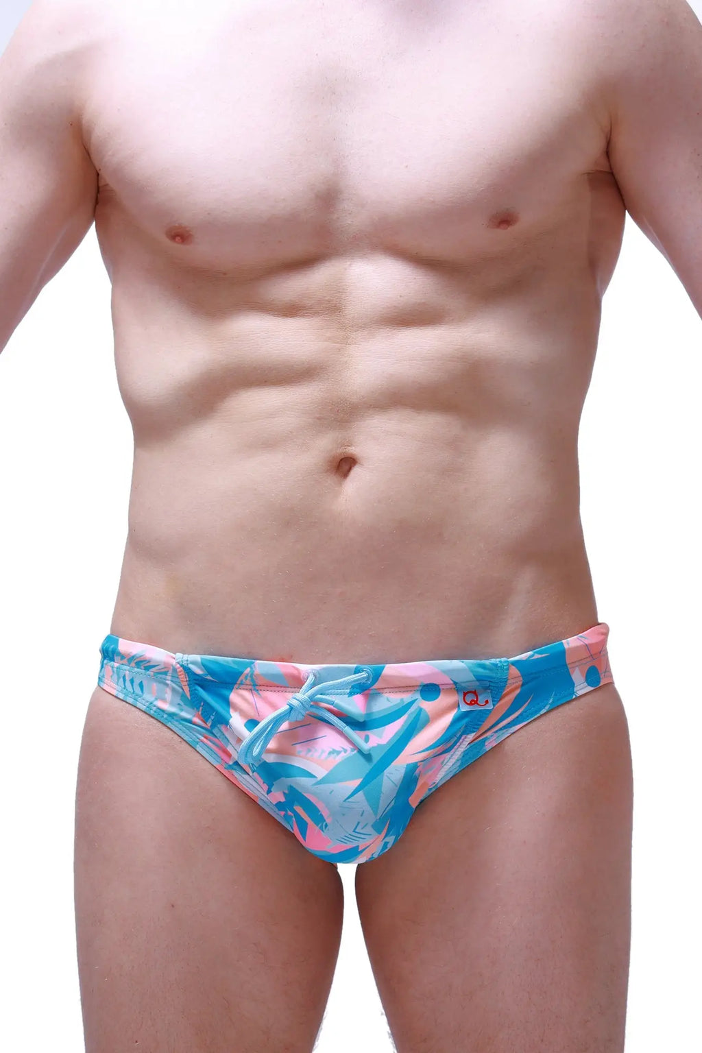PetitQ swim bikini Taik Boucan vibrant blue and pink tropical leaf patterned swim trunks for beachwear
