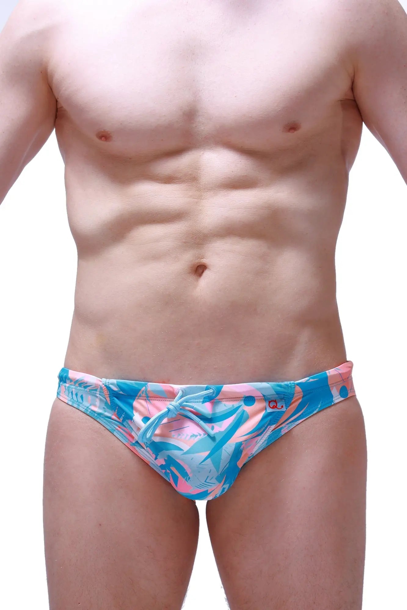 PetitQ swim bikini Taik Boucan vibrant blue and pink tropical leaf patterned swim trunks for beachwear