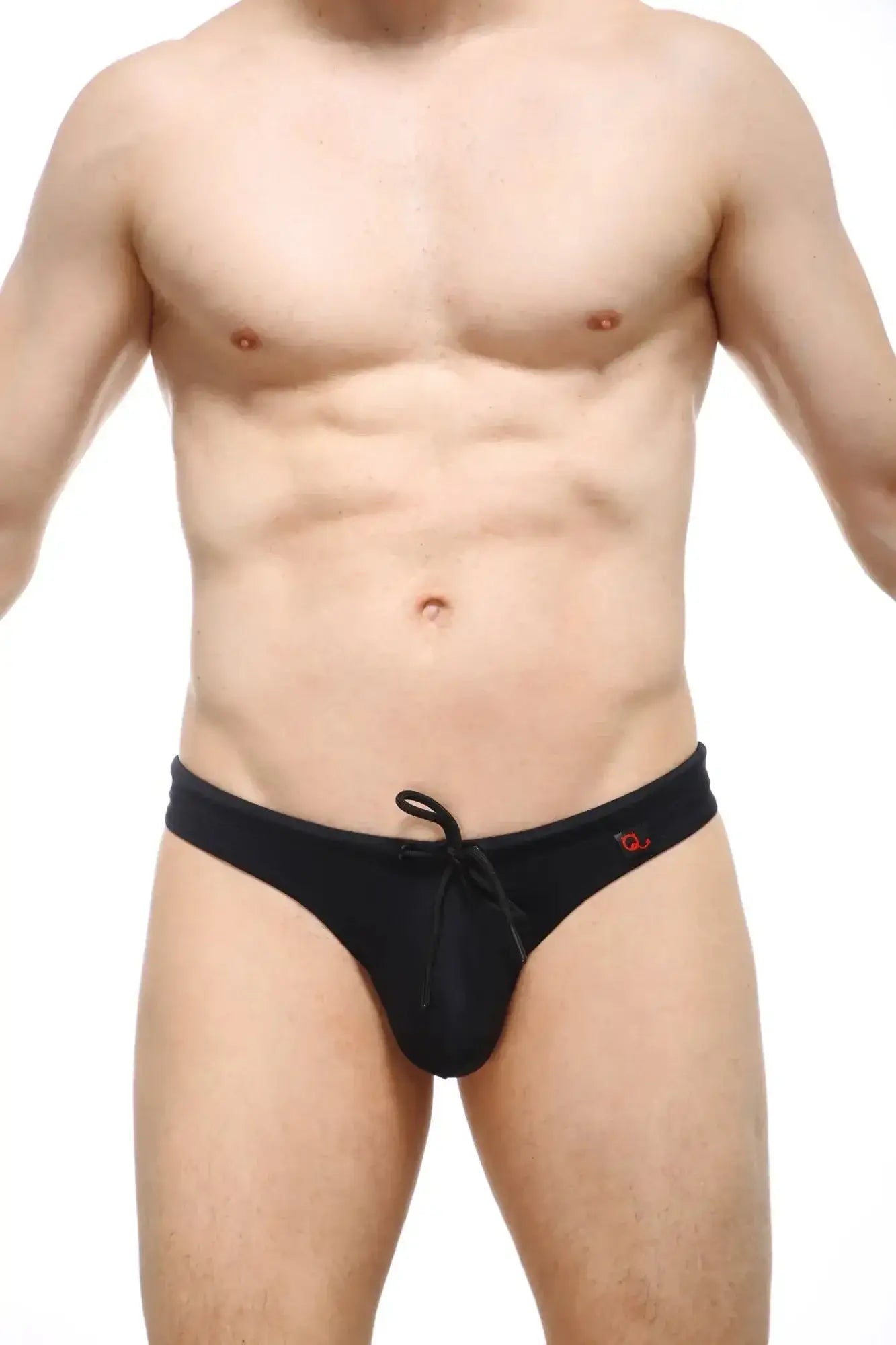 PetitQ swim thong recycled black featuring black swim trunks with drawstring waistband and small red side logo