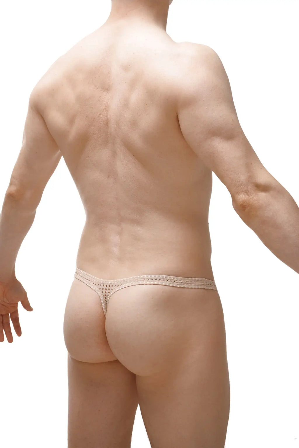 Beige lace thong petitq thong argis durtol nude with a delicate intricate pattern shown from the front