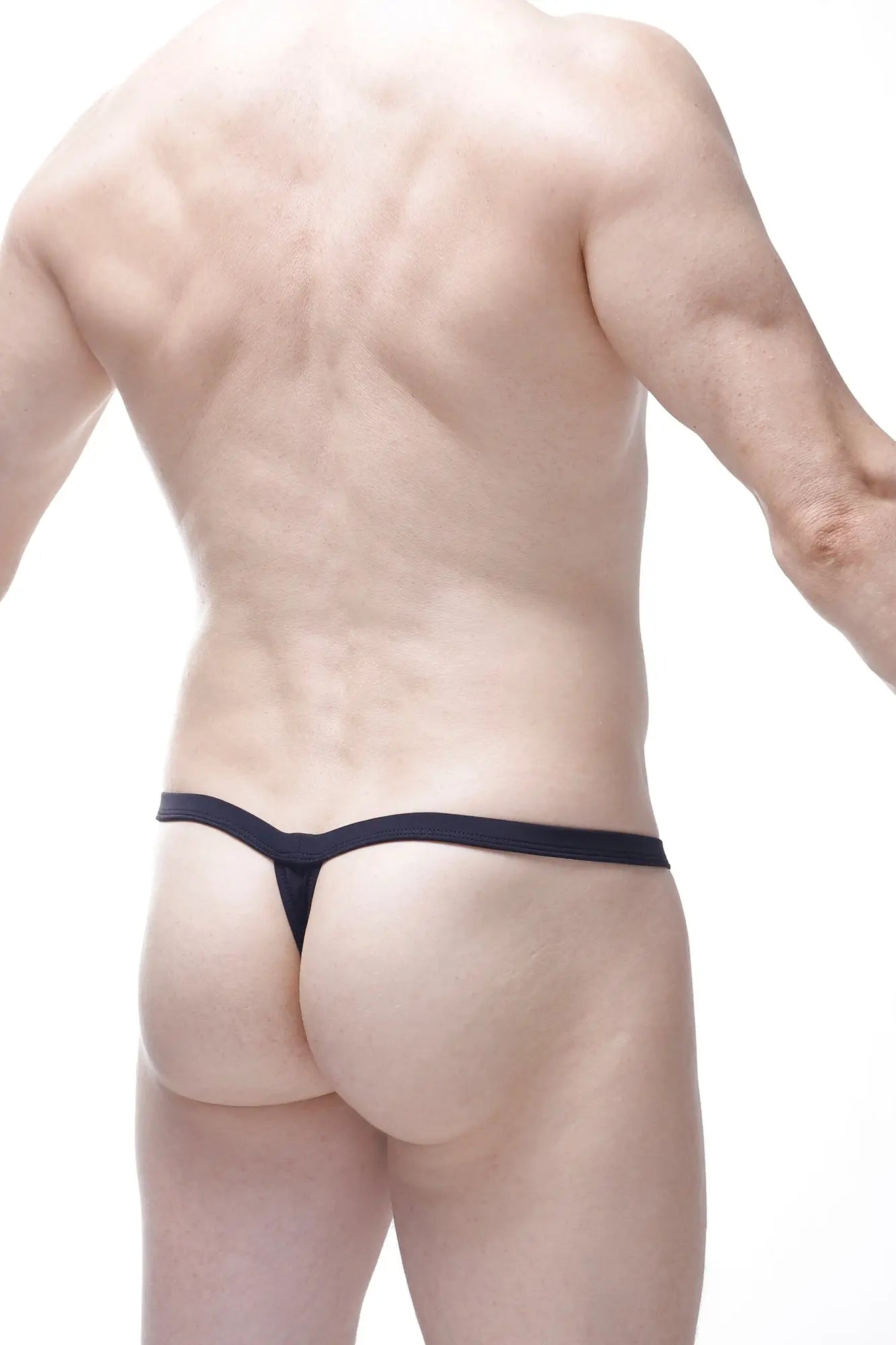 Petitq thong aspach black featuring a narrow smooth elastic band in black shown from the back side