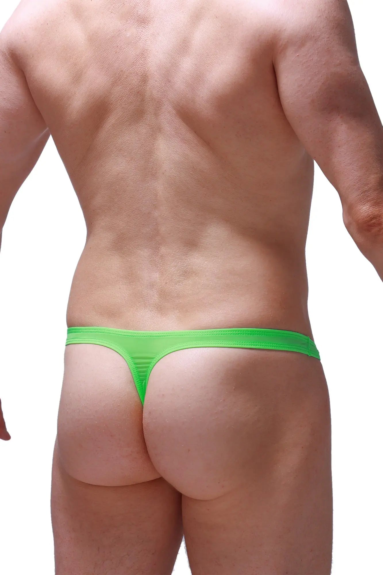 Bright neon green PetitQ thong made of stretchy fabric with a sleek design shown from the back side