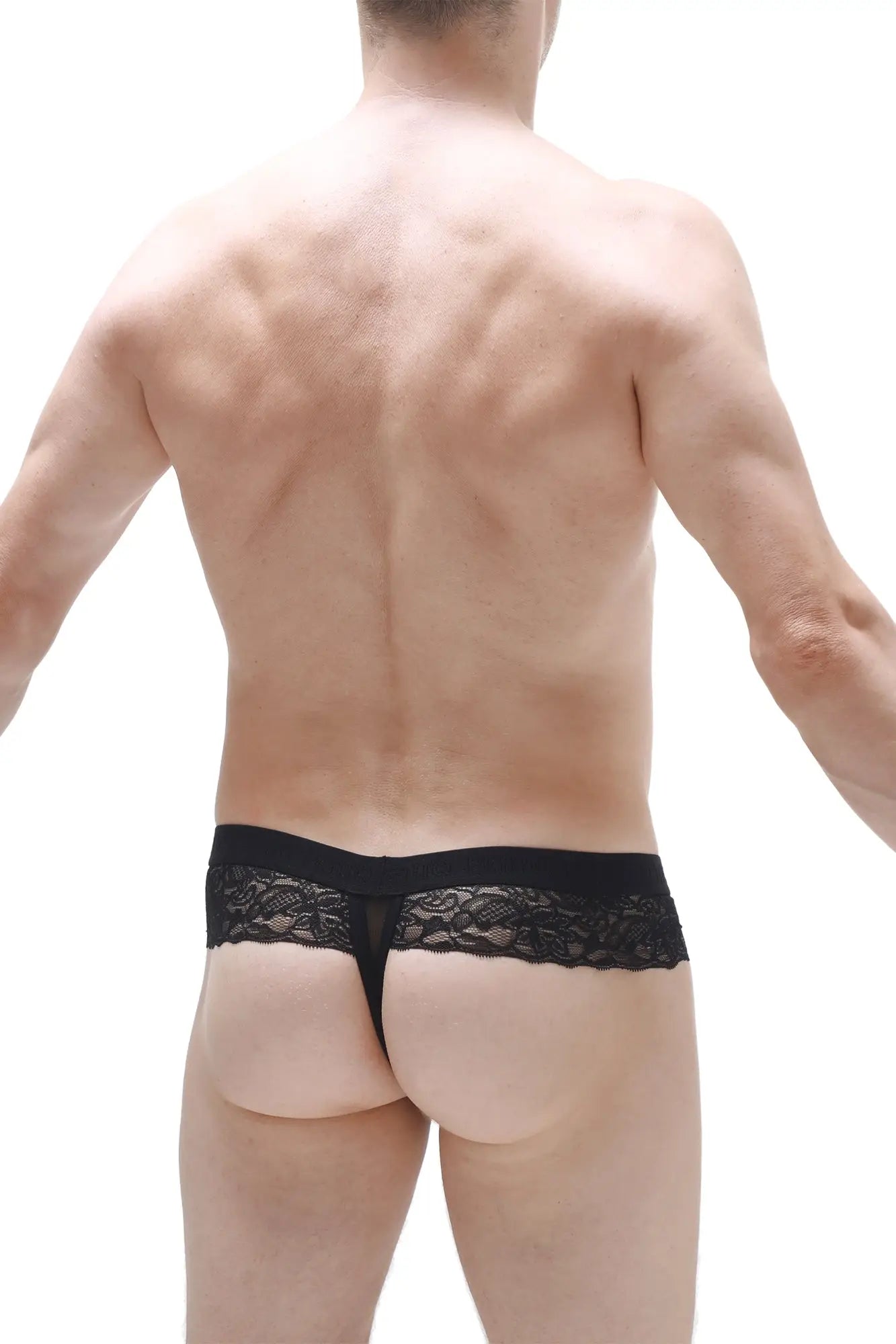Black lace thong PetitQ Thong Barboy black with a delicate intricate pattern along the waistband shown from the back