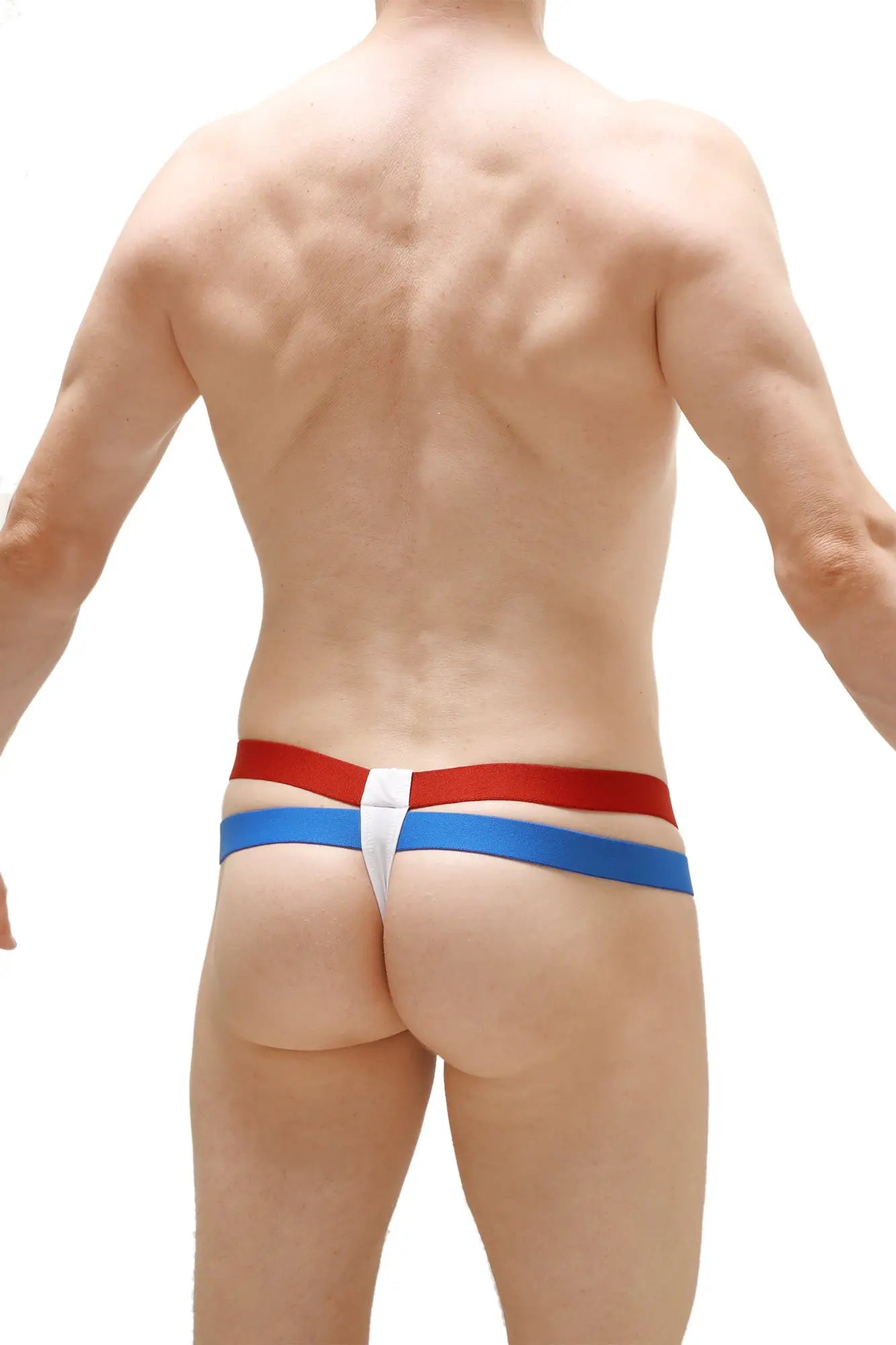 Petitq thong barro white featuring red and blue striped sides with a white central panel for stylish comfort