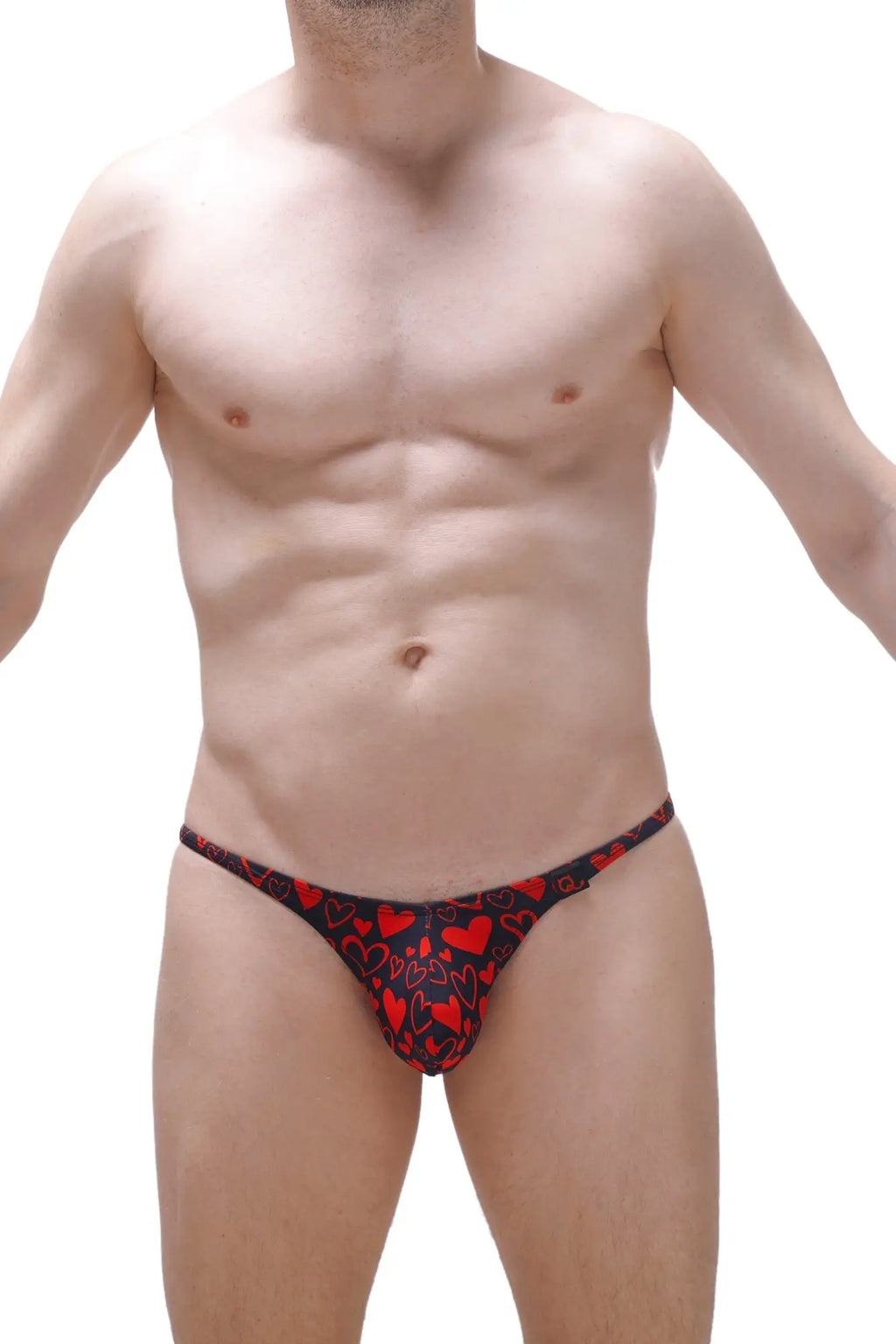 Black thong with red heart pattern from petitq king of hearts collection shown from the back side