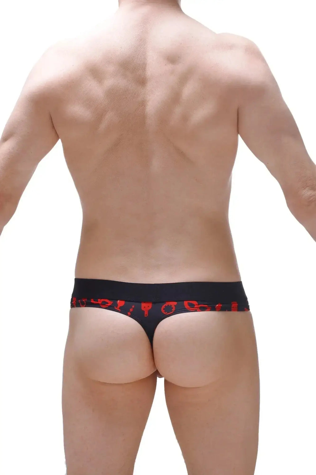 Black petitq thong with red symbolic patterns along the waistband designed as a boudoir cockring accessory