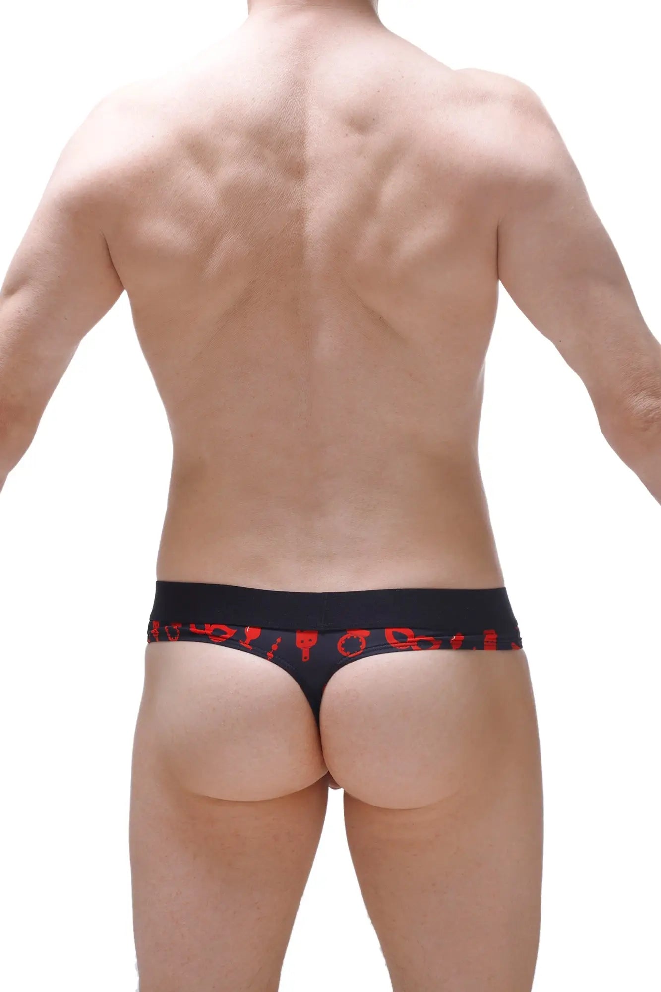 Black petitq thong with red symbolic patterns along the waistband designed as a boudoir cockring accessory