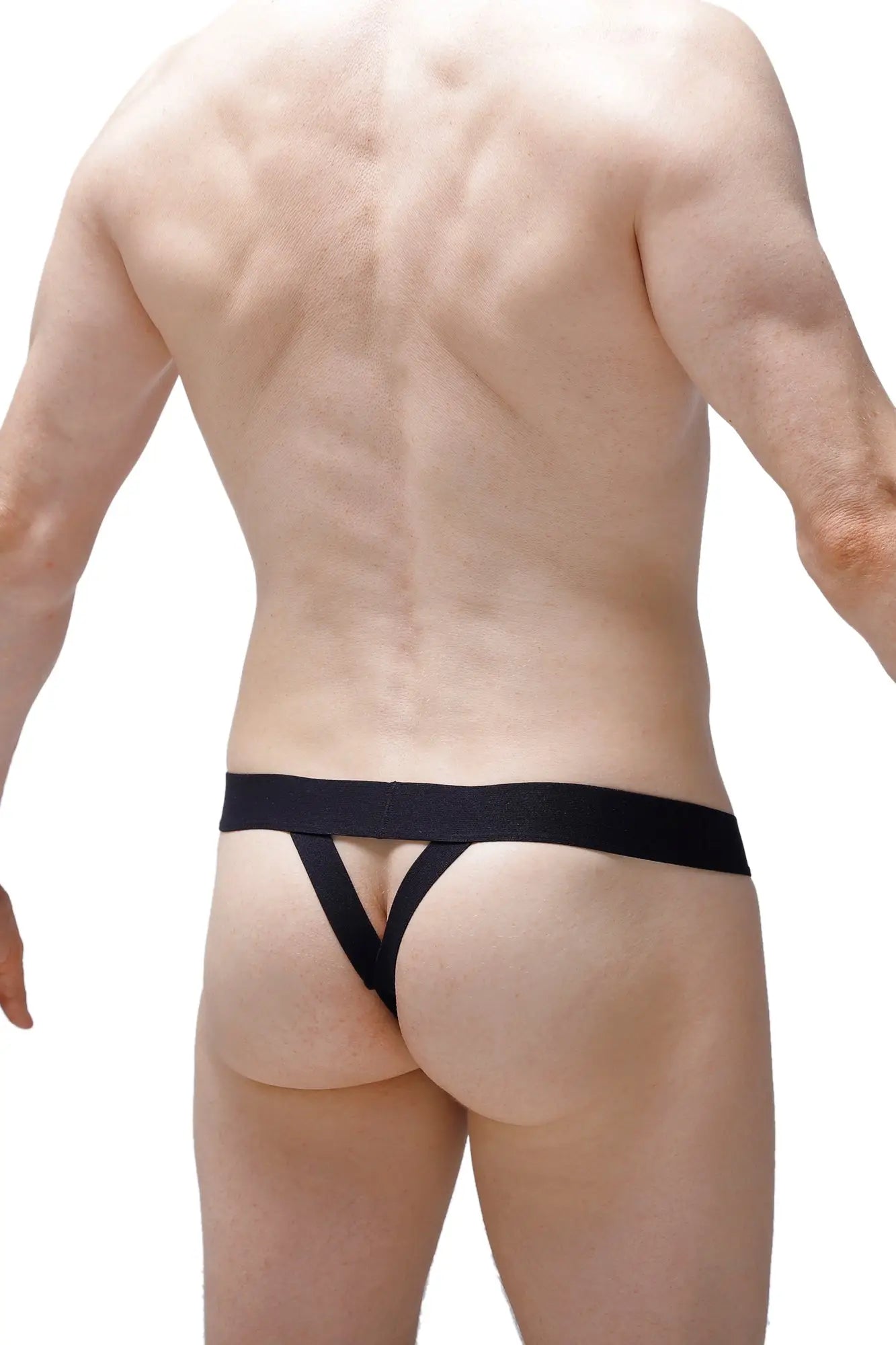 Black sleek form-fitting thong with wide waistband by petitq shown from the back side
