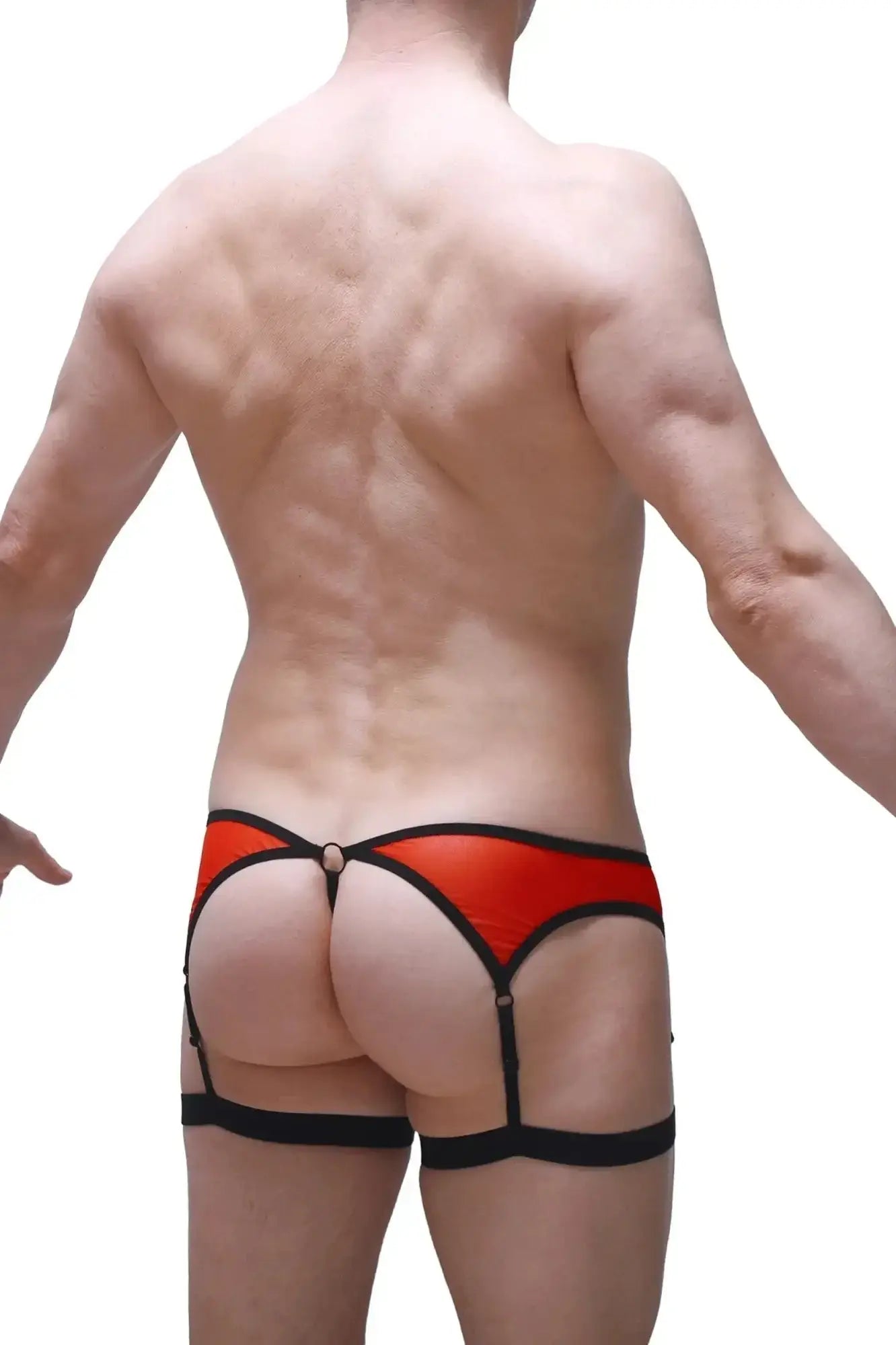 Red and black leather thong with garter straps by petitq roaix showing front view