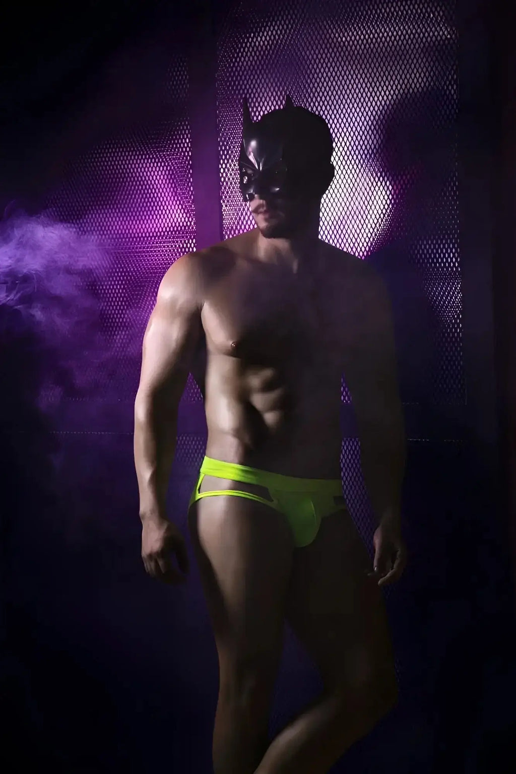 Lifestyle shot of a man wearing Pikante PIK 2114 Lenox Briefs in neon green.