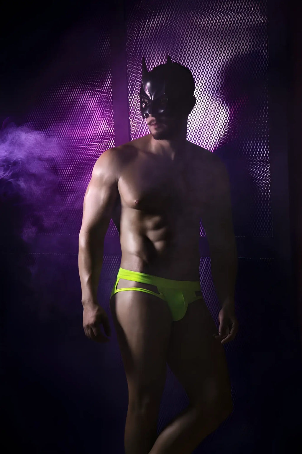 A man wearing a black batman mask modeling pikante pik 2114 lenox briefs in neon green color