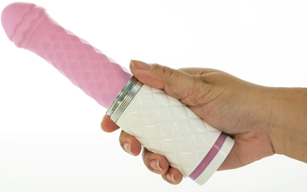 Pink silicone vibrator with white textured base and silver metallic accents from Pillow Talk Feisty Pink collection